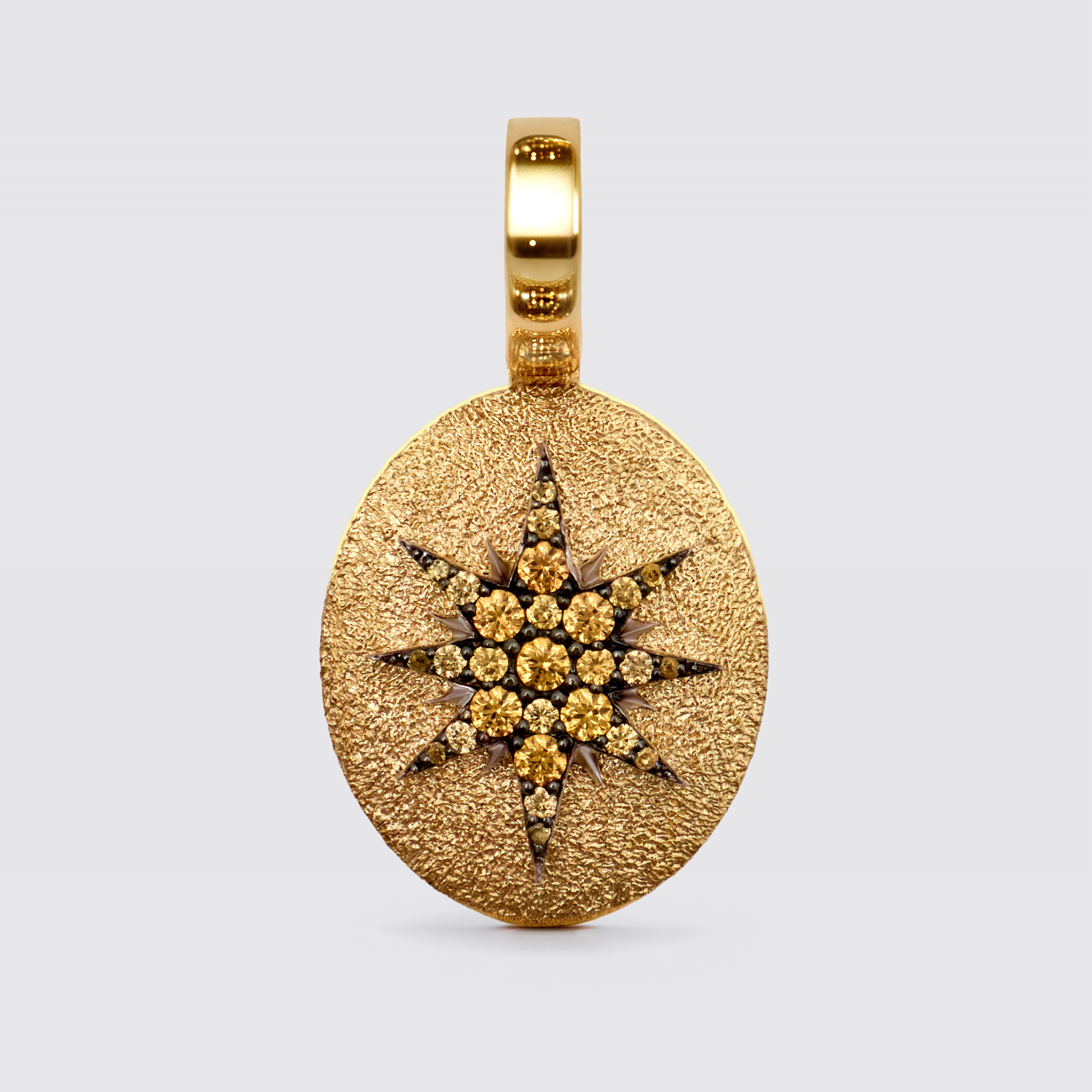 Crush Stella oval pendant in 18k yellow gold with spessartite gemstones arranged in signature 16-point star motif