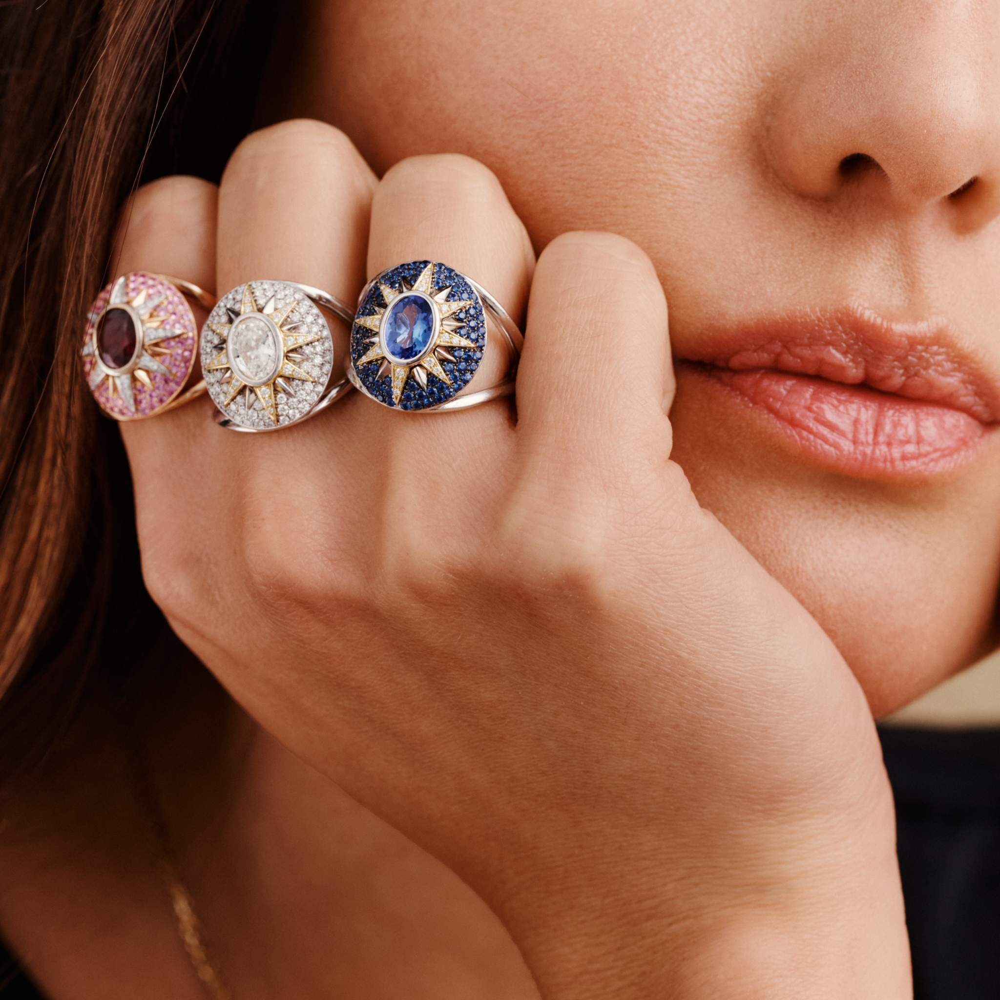 Crush Nova rings featuring oval diamond center with star motif in 18k white gold, worn on hand displaying celestial jewelry design