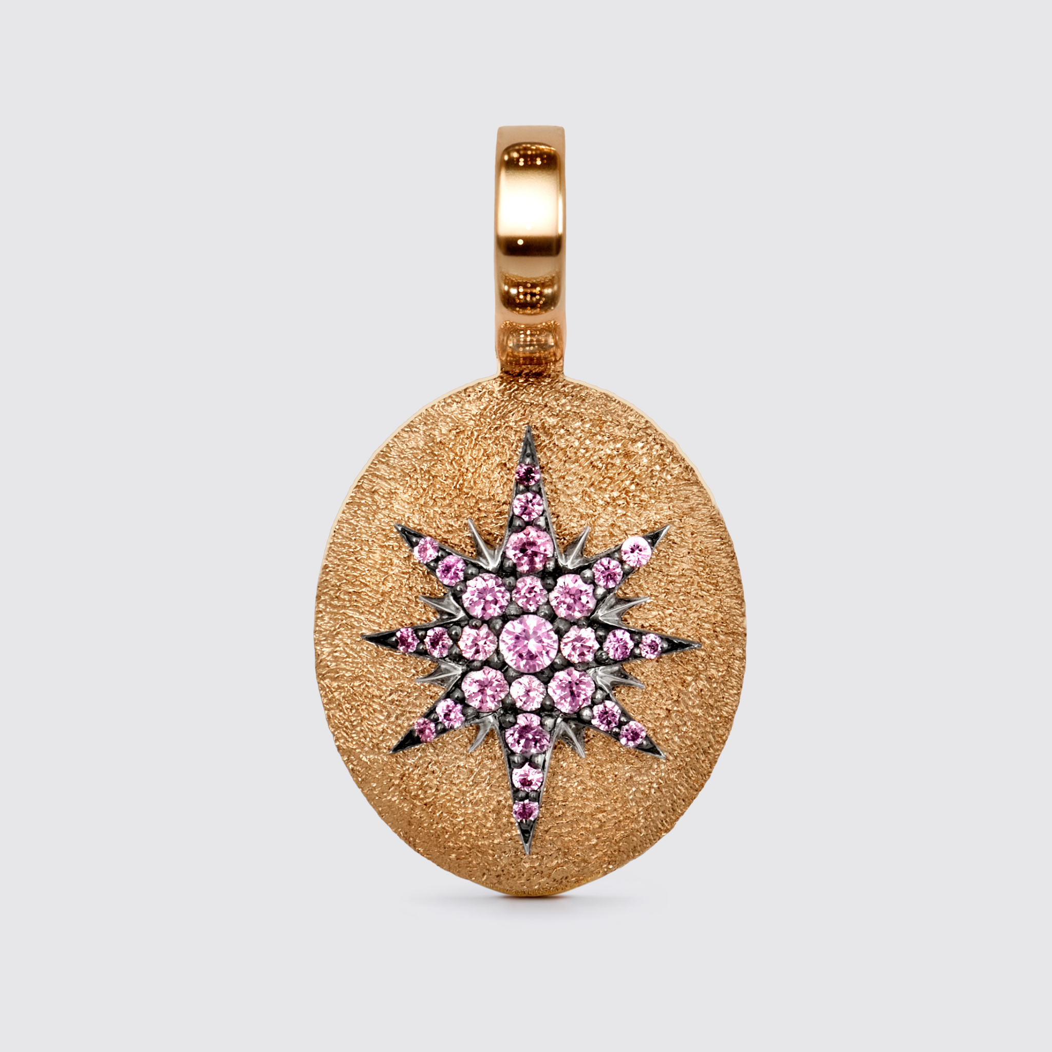 Crush Stella pendant, 18K rose gold oval with pink sapphires forming radiant star motif and black rhodium details