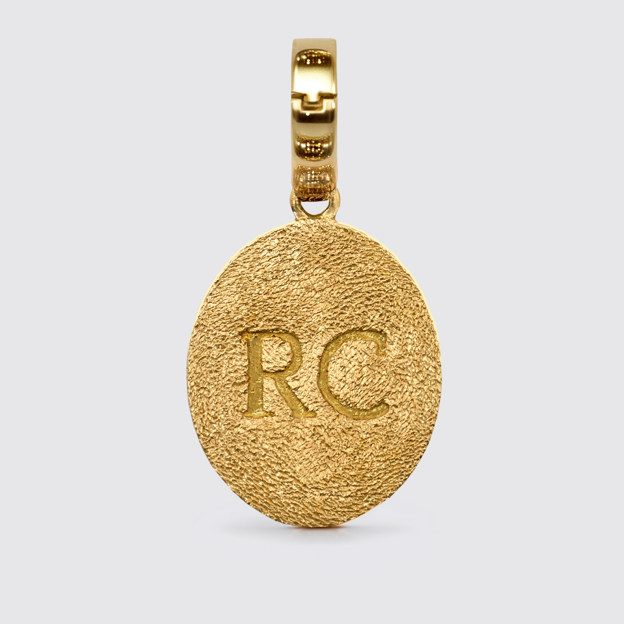 RC monogram gold oval pendant with textured finish and polished baguette bail, luxury jewelry